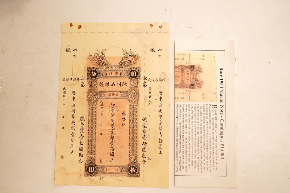 Macau Chan Tung Cheng Bank 1934 10 Yuan banknote, unissued remainder, with original perforated counterfoils. Issued for trade purposes during the Portuguese occupation of Macau. Typical staple holes and light ink blottin